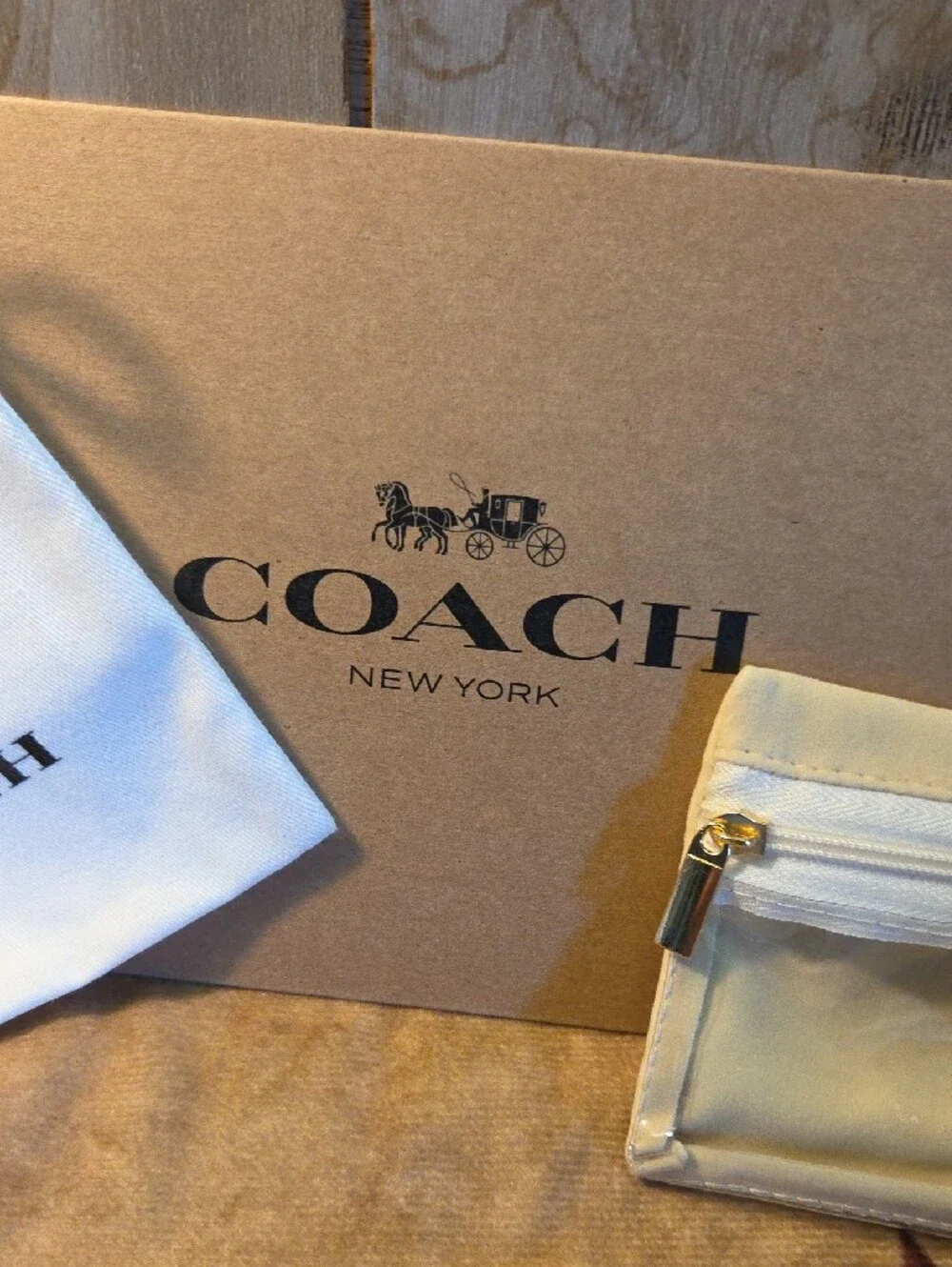 Coach Gold Daisy Pendant Bracelet with Beige Accessories